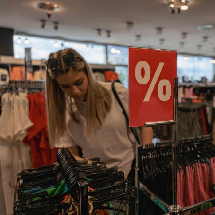 Interior of a cozy coffee shop with barista serving customers