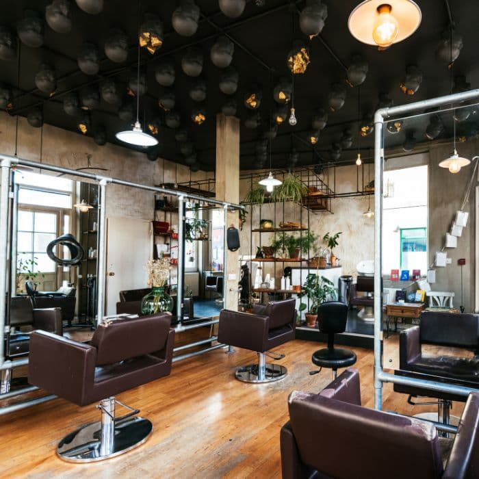 Interior of a cozy coffee shop with barista serving customers